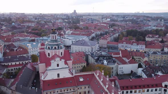 Tower And Exterior Of Church of St. Casimir In Vilnius City, Lithuania At Dusk. aerial orbit, 4k