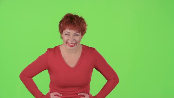 Woman Flirts and Winks with the Men. Green Screen