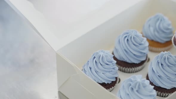 Closeup of Paper Box with Cooked Muffins