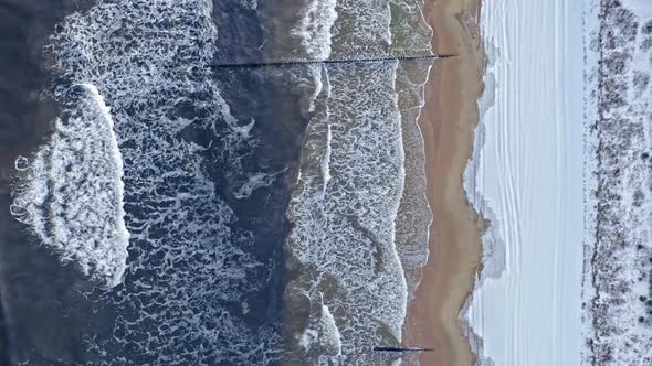 Aerial view of nature. Baltic sea and beach at winter.