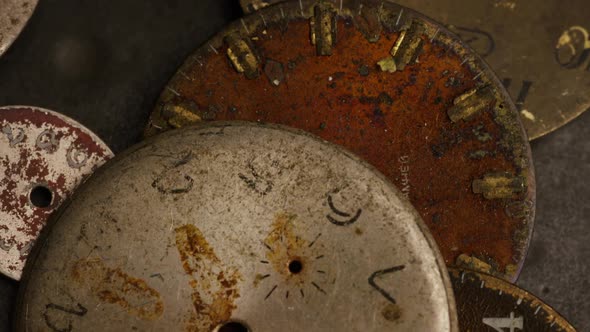 Rotating stock footage shot of antique and weathered watch faces