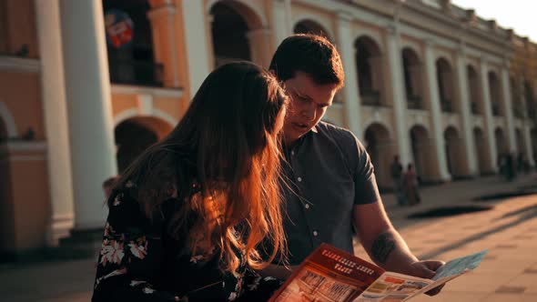 Summer Holidays, Smiling Couple with Map in the City.