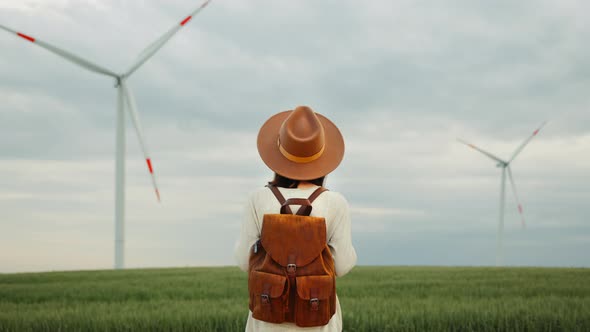 Young tourist against the background of windmills