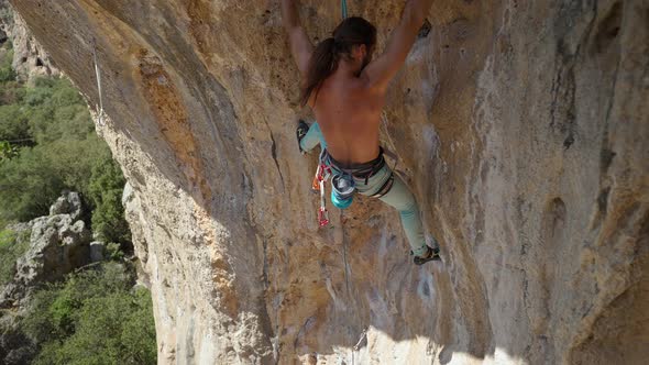 Powerful Rock Climber Climbing on a Big Rock Wall in Turkey