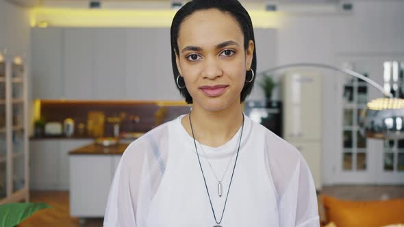 Head Shot Portrait of Happy Mixed Race Girl Smiling African American Millennial Woman Posing Indoor