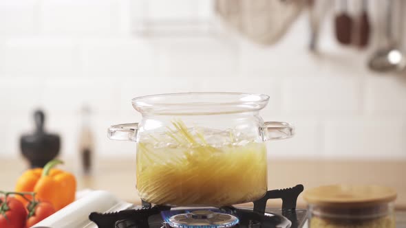 Cooking Spaghetti Pasta In Boiling Water, Glass Bowl Preparing Yellow Pasta