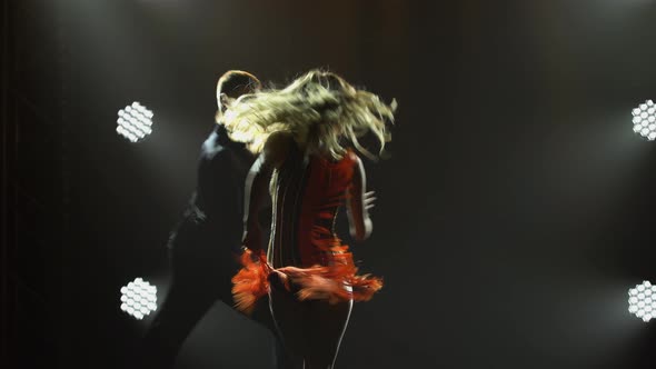 Elements of Fiery Latin American Dance Performed By Pair of Ballroom Dancers