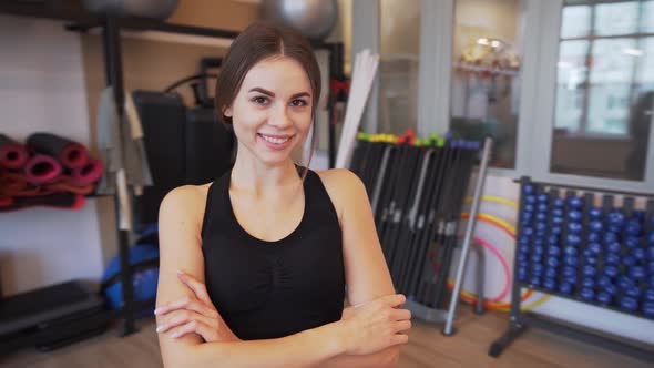 4x Slow Motion Video of Beautiful Young Woman Working Out and Stretching Indoors