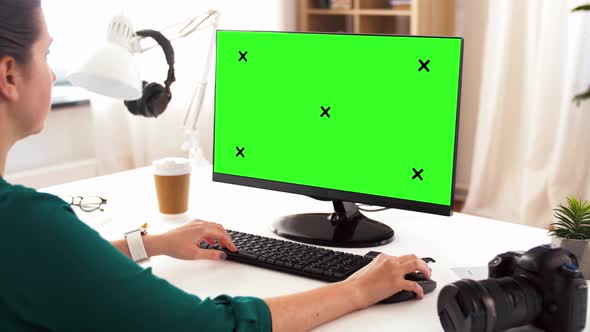 Woman with with Green Screen on Computer at Home