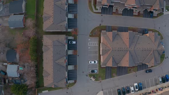 Top down drone view of townhouse complex and parking lot