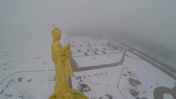 Golden saint on the belltower top, aerial view