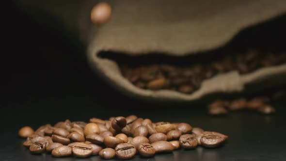 Coffee Beans Fall Near A Lying Cloth Bag