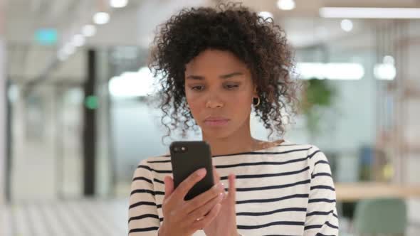 Attractive African Woman Using Smartphone