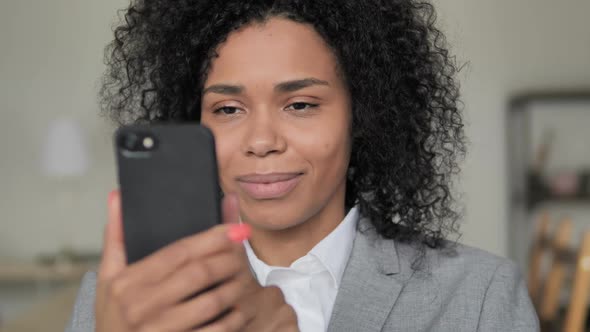 African Businesswoman Browsing Smartphone