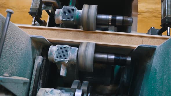 Machine Makes Grooves in Wooden Beam in Carpentry Workshop