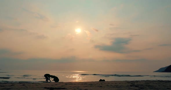 Young Couple Looking Towards the Sun, Against the Sunset, Holding Hands, Go To the Sea, a Romantic