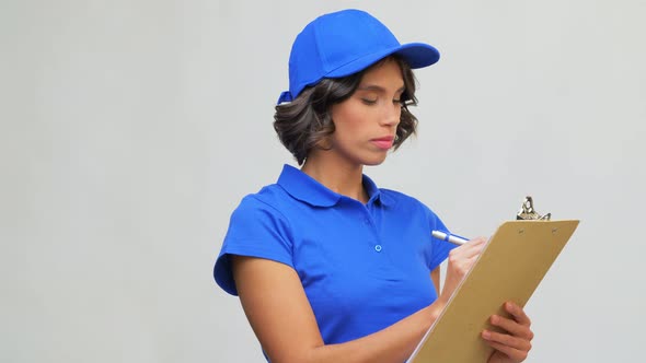 Happy Delivery Girl with Clipboard and Pen Writing