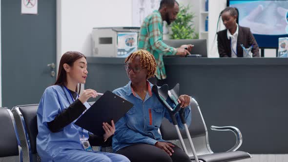 African American Woman with Crutches Suffering From Physical Impairment