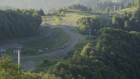 Beautiful Summer Landscape with Cableway, Mountain Range and Green Forest in Russian Caucasus