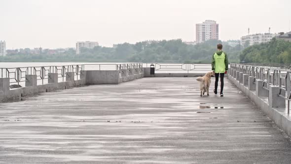 Child Walking with Fluffy Best Friend