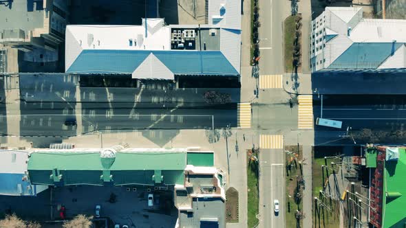 Vehicles are Riding Along the Intersection in a Top View