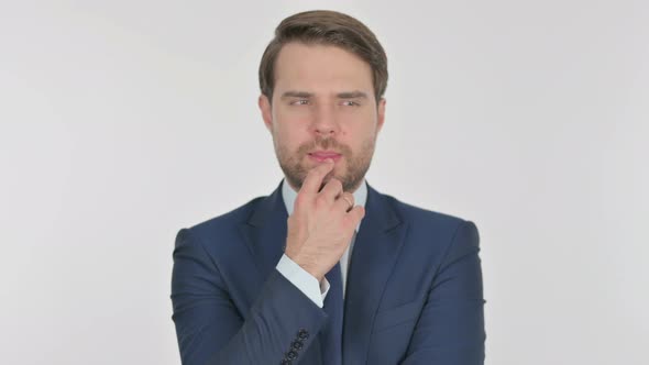 Pensive Young Businessman Thinking and getting Idea on White Background