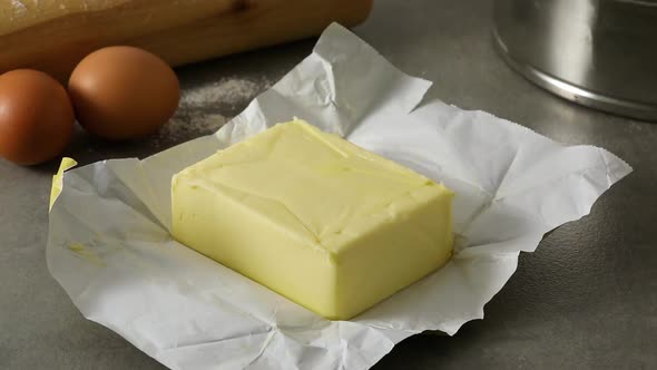 Butter with the wrapper open for use as a baking ingredient  