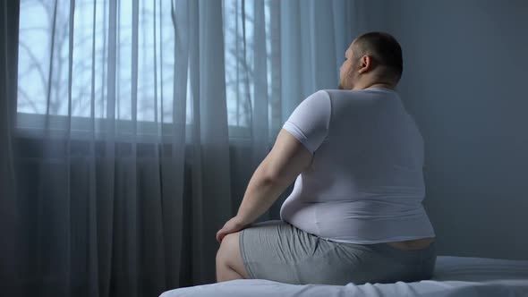 Obese Male Stretching Shoulder Muscles, Orthopedic and Rheumatologic Disorders