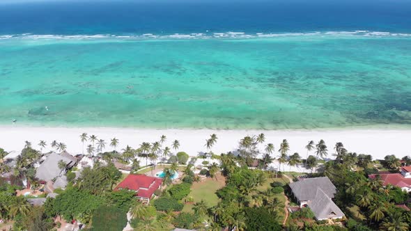 Ocean Coastline Barrier Reef By Beach Hotels at Low Tide Zanzibar Aerial View