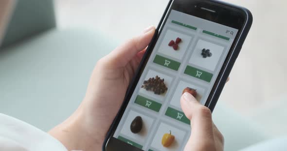 Ordering Food Vegetables and Fruits Online Using Smartphone App Close Up