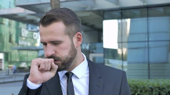 Sick Beard Businessman Coughing While Standing Outdoor