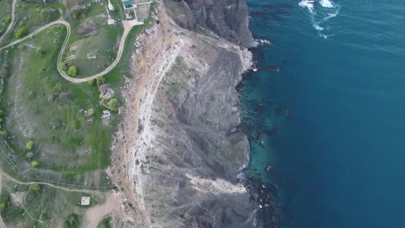 Aerial View of the Coast with a Blue Sky and a Blue Sea From a Helicopter