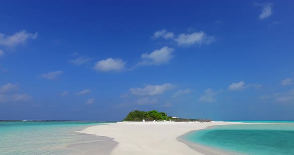 Tropical aerial copy space shot of a white paradise beach and aqua blue water background in colorful