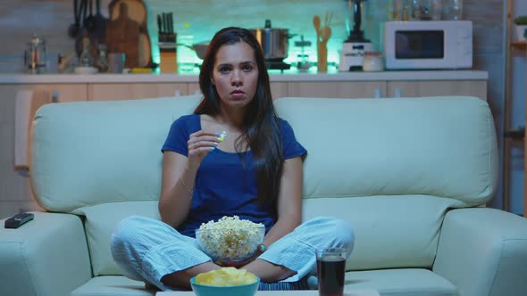 Person Holding Pop Corn Bowl Watching Movie