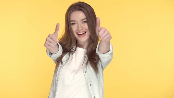 Young Woman Showing Thumbs up Gesture