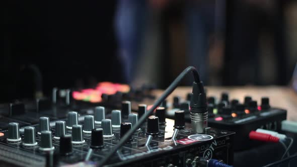 Dj Working at the Event Uses Audio Mixer