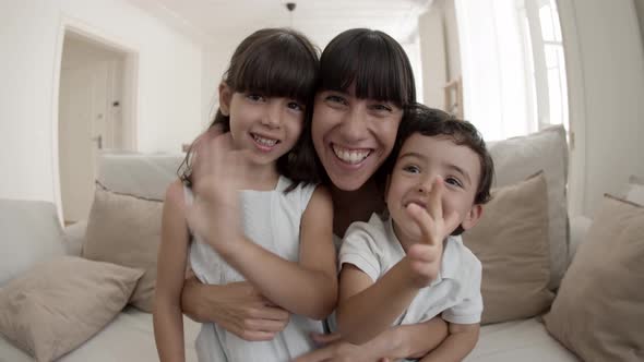 Happy Mom and Two Cute Kids Having Video Call