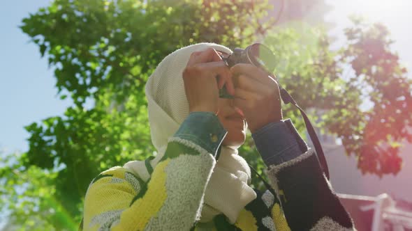 Young woman wearing hijab out and about in the city