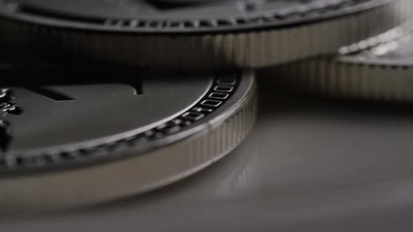 Rotating shot of Litecoin Bitcoins (digital cryptocurrency) - BITCOIN LITECOIN 0188