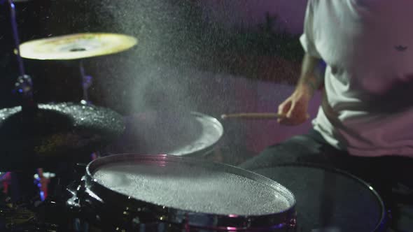 Super Slow Motion Shot of Drum Hit and Splashing Water at 1000 Fps