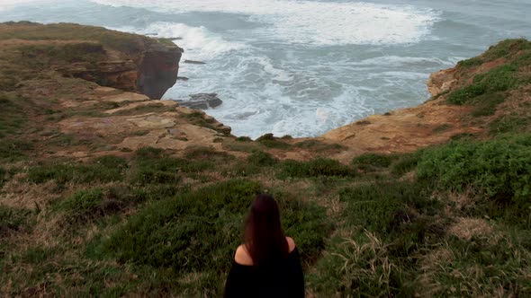 Woman on a cliff