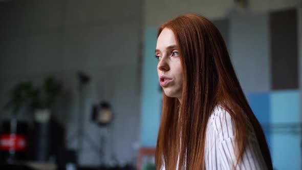 Close-up of Serious Young Woman Psychologist Supporting and Consoling Depressed Patient at Office