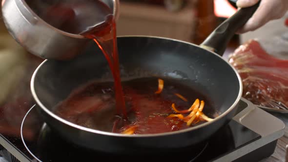 Red Liquid Pours on Pan.