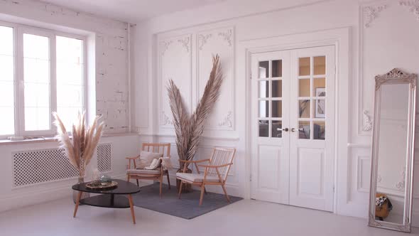 Beautiful Classical White Interior with a Sofa and a Coffee Table