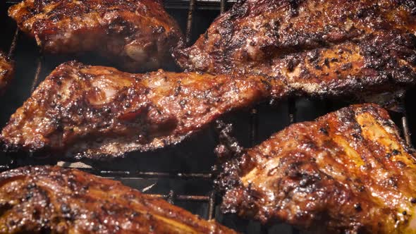 Tasty Ribs Cooking on Barbecue Grill for Summer Outdoor Party