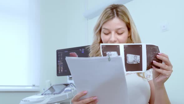 Woman Looks at the Result of a Sound Survey.