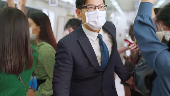 Crowd of People Wearing Face Mask on a Crowded Public Subway Train Travel