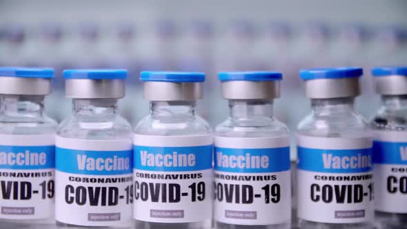 Glass vials for Covid-19 vaccine in laboratory. Group of Coronavirus vaccine bottles.