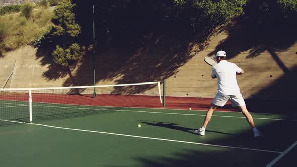 Man playing tennis on a sunny day