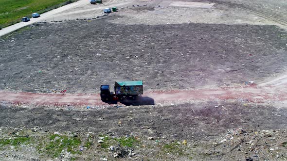 Garbage Truck Leaving A Scrap Yard, Drone Stock Footage